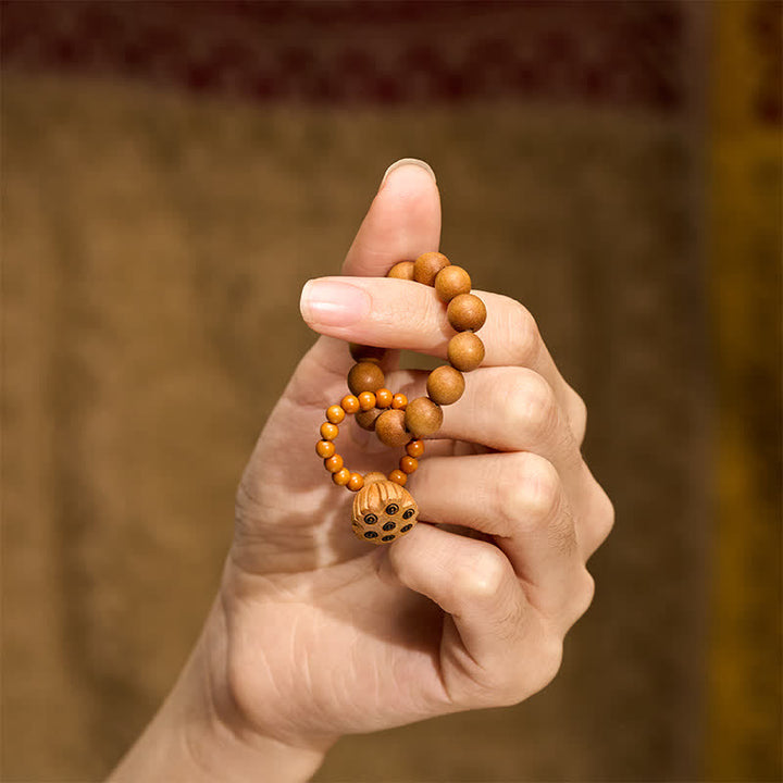 Buddha Stones Decoraciones de cuentas de meditación táctiles pulidas a mano con forma de cápsula de loto de sándalo verde para la sanación. - image 12
