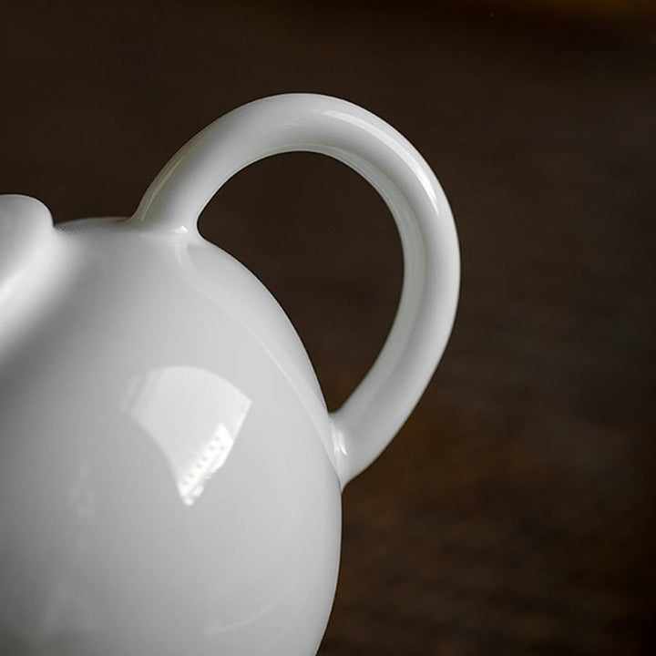 Tetera de cerámica con diseño grabado de bambú de pino ciruelo blanco