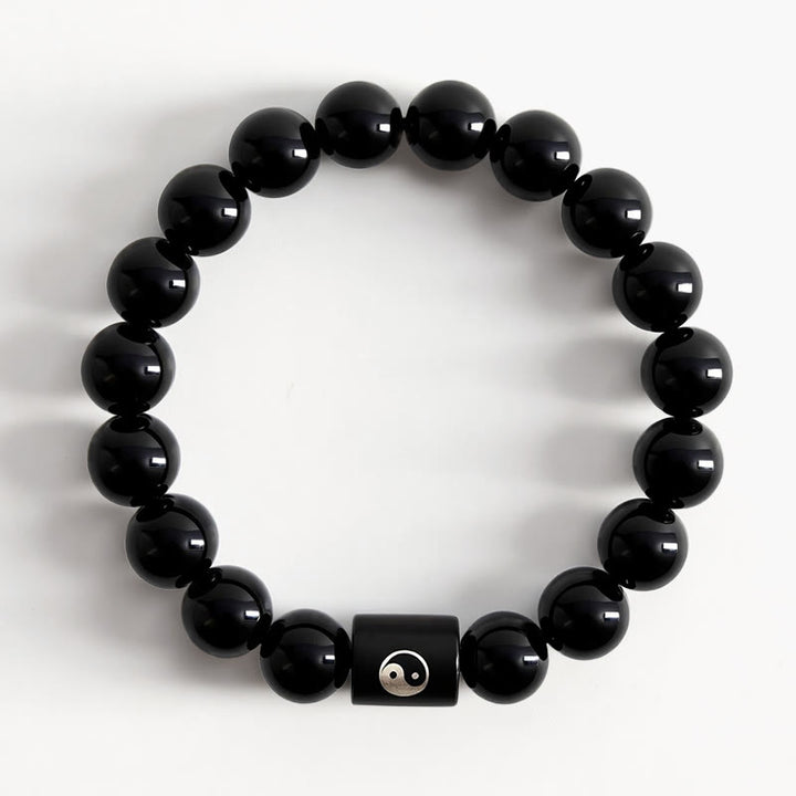 Buddha Stones Pulsera de cuentas cilíndricas con incrustaciones de madera de ébano y símbolo de equilibrio Yin Yang. - image 1