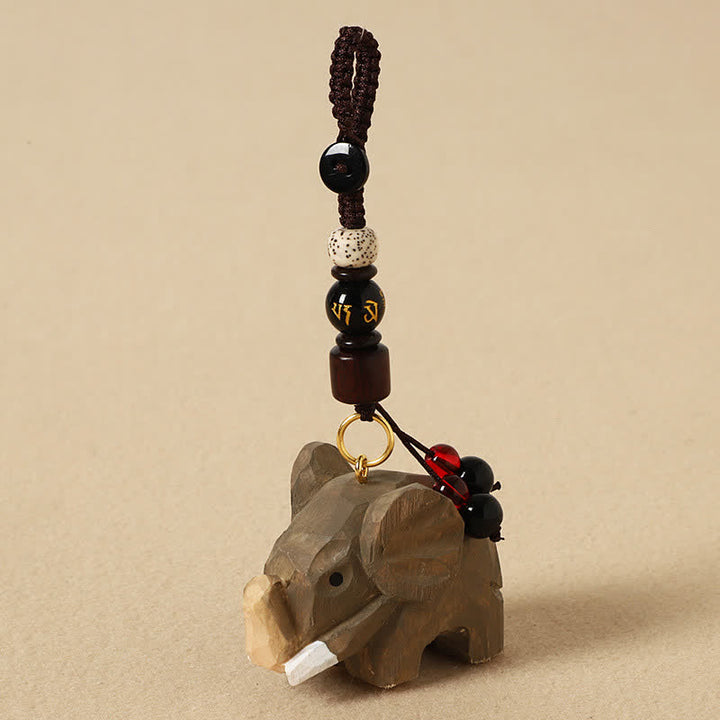Buddha Stones Llaveros de madera natural con diseño de elefante, paz, Om Mani Padme Hum y pureza. - Elefante Om Mani Padme Hum - image 0