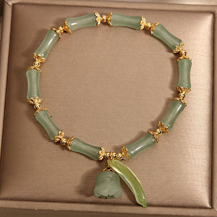 Buddha Stones Pulsera con dije de lirio del valle, aventurina verde y bambú para la buena suerte y el crecimiento. - image 1
