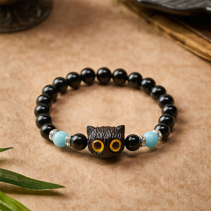 Buddha Stones Pulsera de cuentas con relieve de gato de ojos grandes tallada a mano en obsidiana negra - image 1