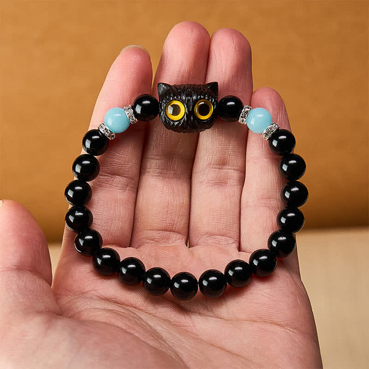 Buddha Stones Pulsera de cuentas con relieve de gato de ojos grandes tallada a mano en obsidiana negra - image 11