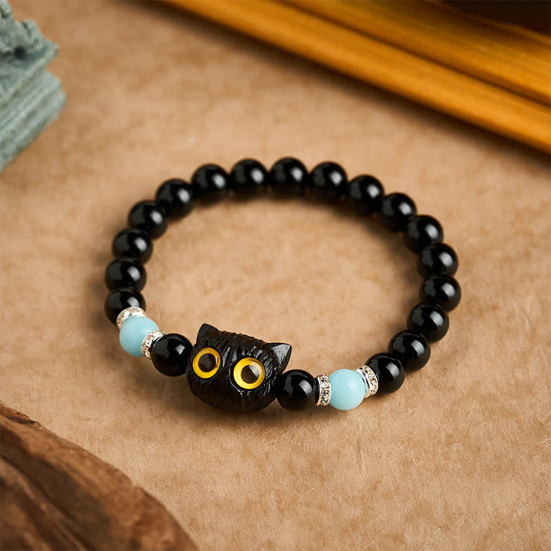Buddha Stones Pulsera de cuentas con relieve de gato de ojos grandes tallada a mano en obsidiana negra - image 11