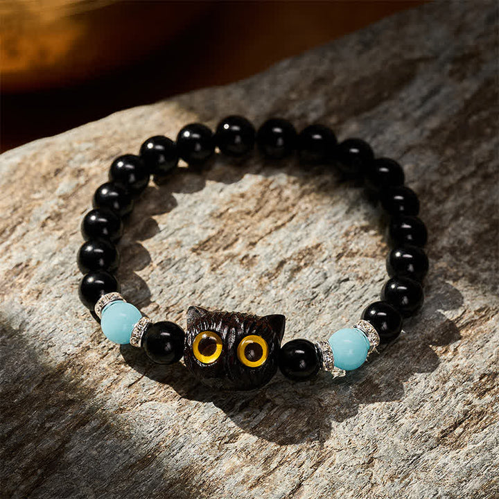 Buddha Stones Pulsera de cuentas con relieve de gato de ojos grandes tallada a mano en obsidiana negra - image 2