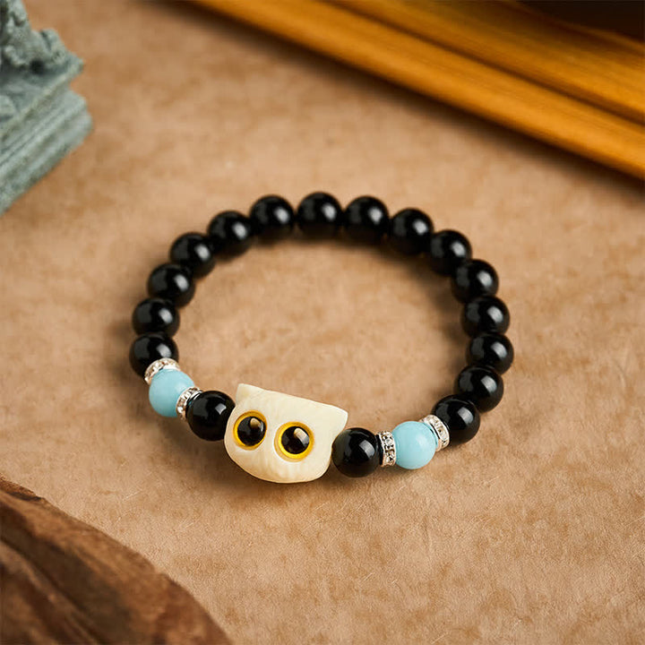 Buddha Stones Pulsera de cuentas con relieve de gato de ojos grandes tallada a mano en obsidiana negra - image 19