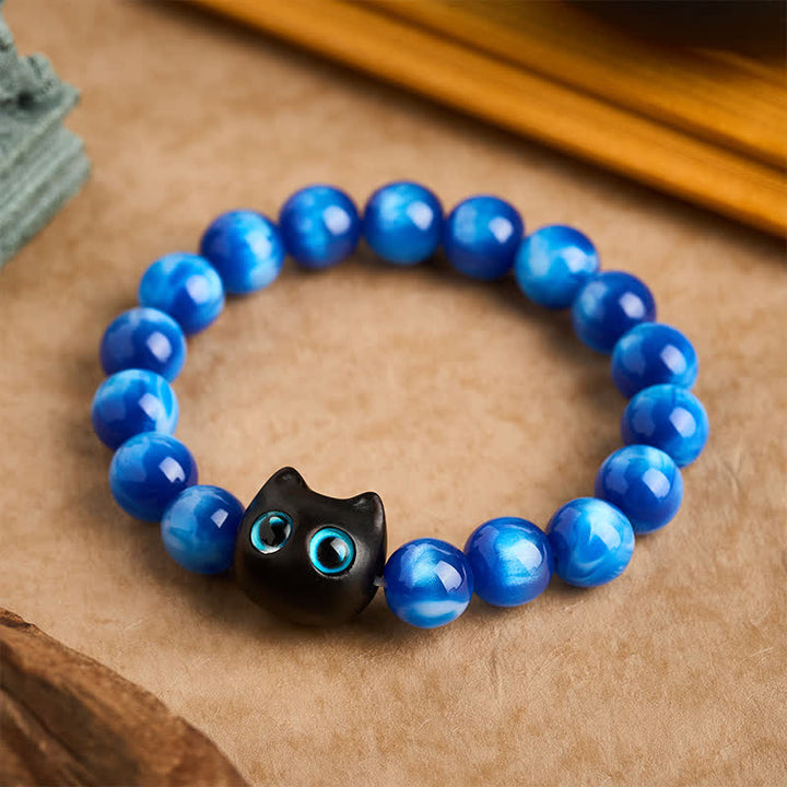 Buddha Stones Pulsera de equilibrio con forma de gato, cuentas de resina azul y madera de ébano - 12 mm (circunferencia de la muñeca: 6,7-7,1 pulgadas / 17-18 cm) - image 0