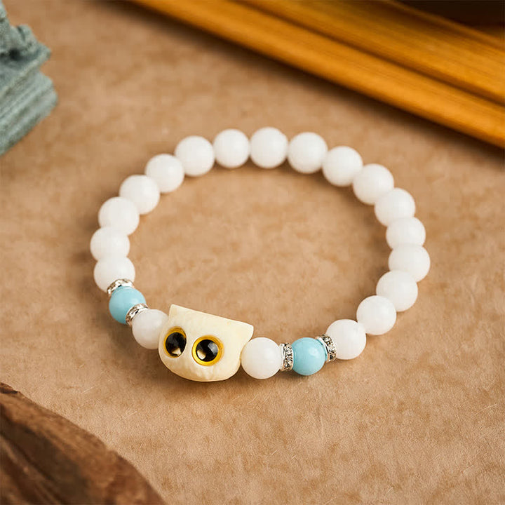 Buddha Stones Pulsera de cuentas de pureza con cabeza de gato de ojos grandes, obsidiana negra y calcedonia blanca - image 1