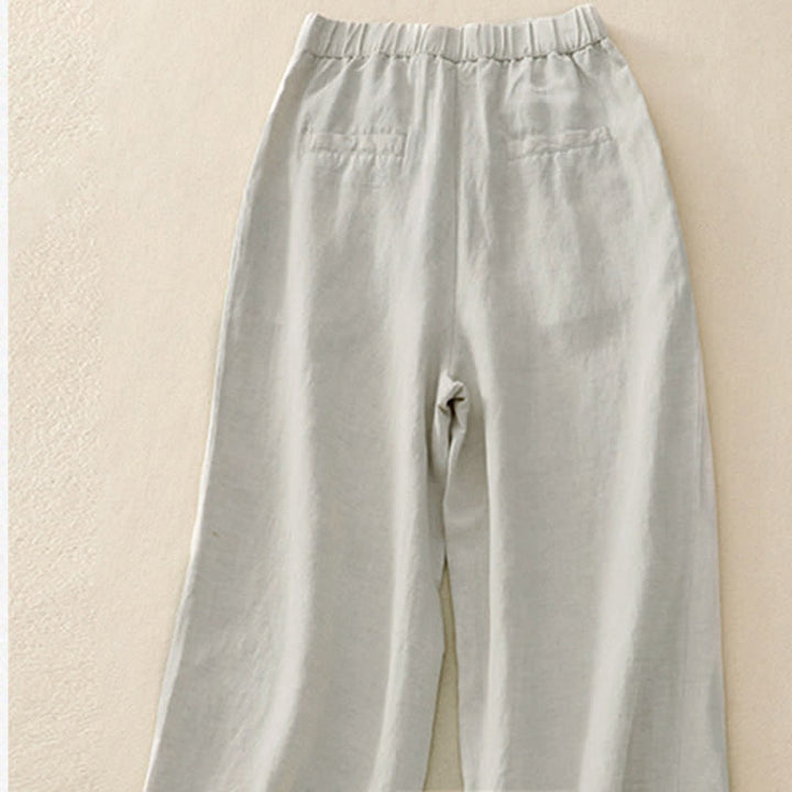 Pantalones de mujer con Buddha Stones, color liso, cierre frontal, cintura elástica y bolsillos. - image 1