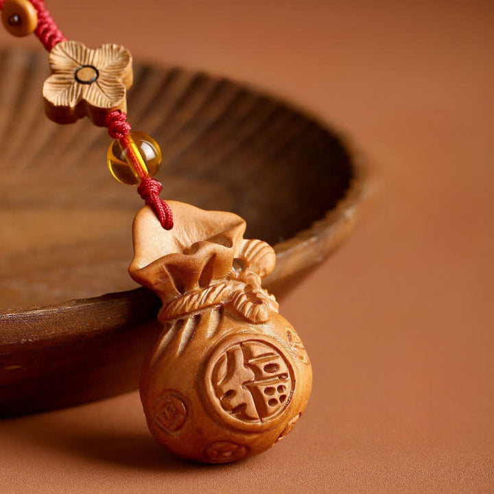Buddha Stones Llaveros con dije de loto y bolsa de la suerte de madera de durazno Fu - image 2