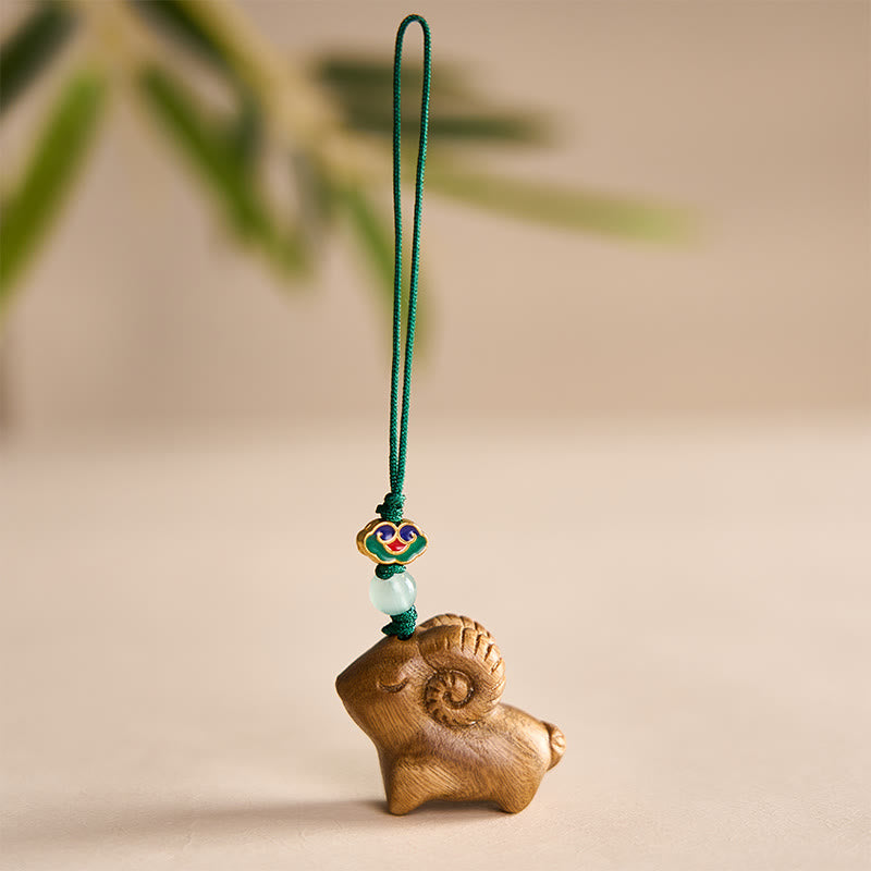 Buddha Stones Llaveros con forma de cabra tallados a mano en madera de sándalo - Verde - image 0