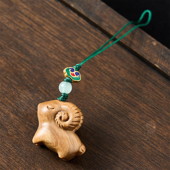 Buddha Stones Llaveros con forma de cabra tallados a mano en madera de sándalo - image 10