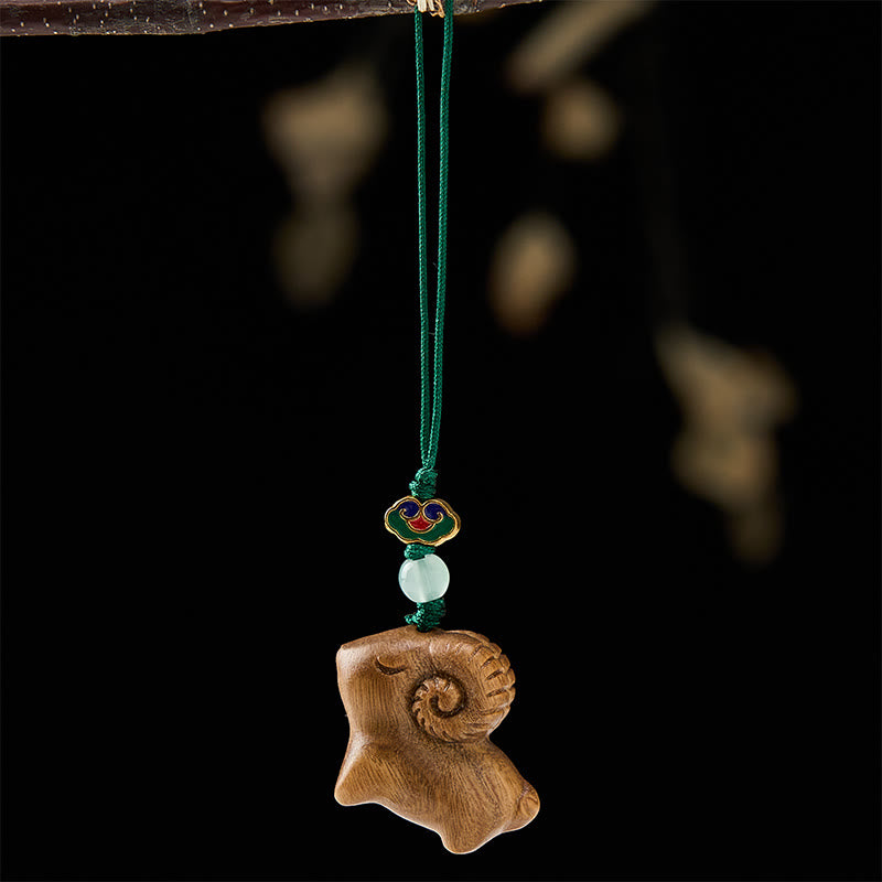 Buddha Stones Llaveros con forma de cabra tallados a mano en madera de sándalo - image 2