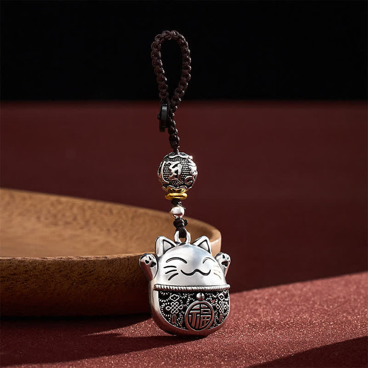 Buddha Stones Llaveros trenzados de cobre grabados con el personaje Fu y el gato de la suerte. - image 1