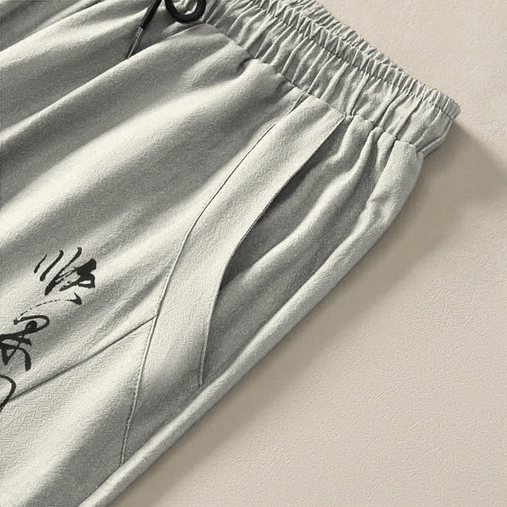 Buddha Stones Pantalones de hombre de algodón puro con estampado de flores de ciruelo y cordón ajustable, corte cónico y bolsillos. - image 4