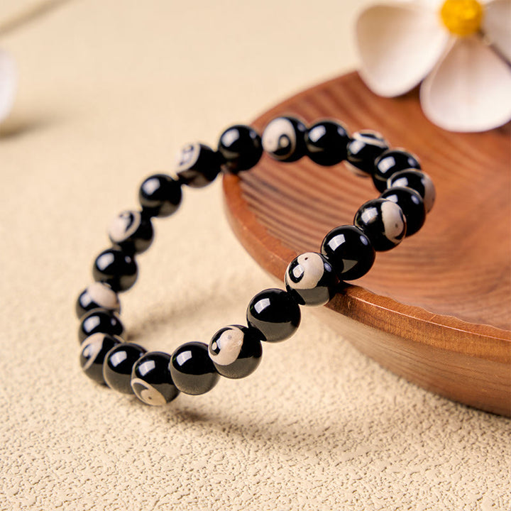 Buddha Stones Pulsera de equilibrio con cuentas Yin Yang de ónix negro - image 1