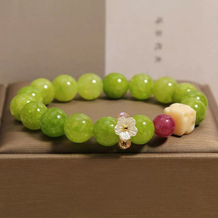 Buddha Stones Pulsera de cuentas con dije de flor de peridoto para sanación - image 7