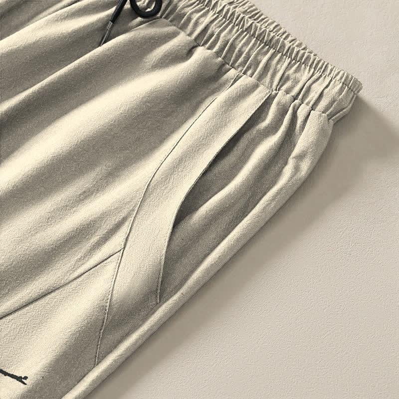 Buddha Stones Pantalones de hombre de algodón puro con estampado de flores de ciruelo y cordón ajustable, corte cónico y bolsillos. - image 4