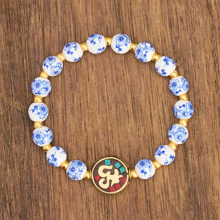 Buddha Stones Pulsera de cuentas de compasión OM de cobre y porcelana azul y blanca - image 2