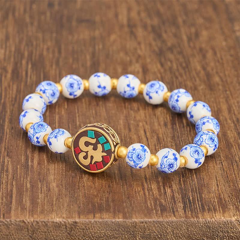 Buddha Stones Pulsera de cuentas de compasión OM de cobre y porcelana azul y blanca - image 1