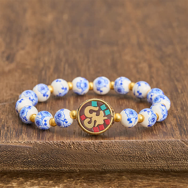 Buddha Stones Pulsera de cuentas de compasión OM de cobre y porcelana azul y blanca - OM (Conexión de atención plena ♥) - image 0