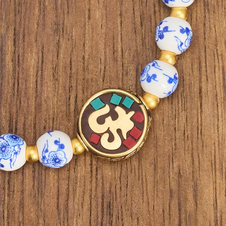Buddha Stones Pulsera de cuentas de compasión OM de cobre y porcelana azul y blanca - image 4