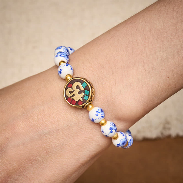 Buddha Stones Pulsera de cuentas de compasión OM de cobre y porcelana azul y blanca - image 3