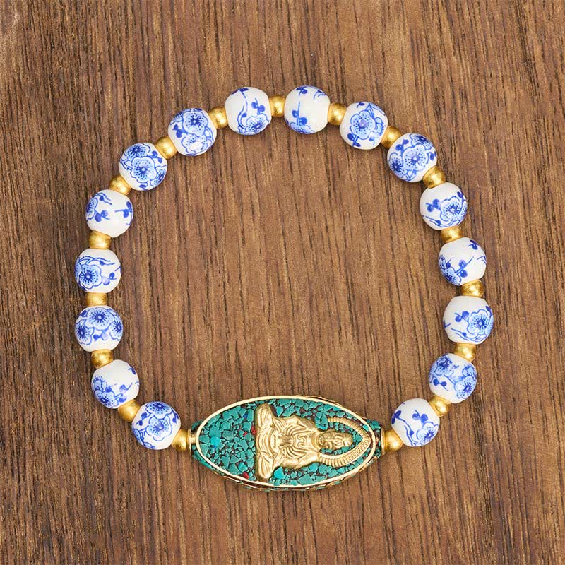 Buddha Stones Pulsera de porcelana blanca con Buda y cuentas redondas florales azules "Serenity" - image 1