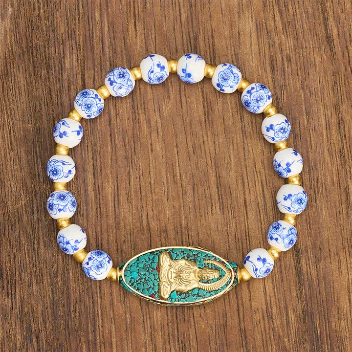 Buddha Stones Pulsera de porcelana blanca con Buda y cuentas redondas florales azules "Serenity" - image 1