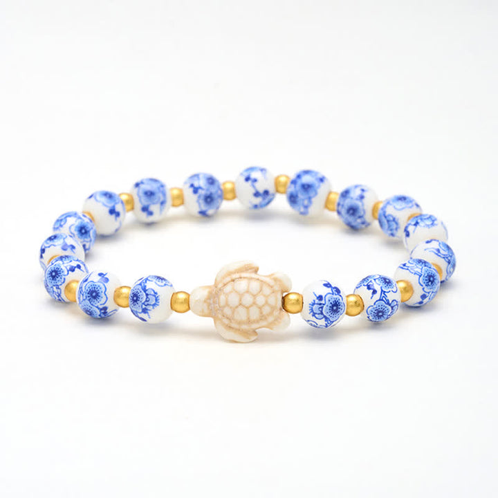 Buddha Stones Pulsera de porcelana azul y blanca con forma de tortuga, símbolo de pureza y longevidad. - Tortuga (Sabiduría ♥ Resistencia) - image 0