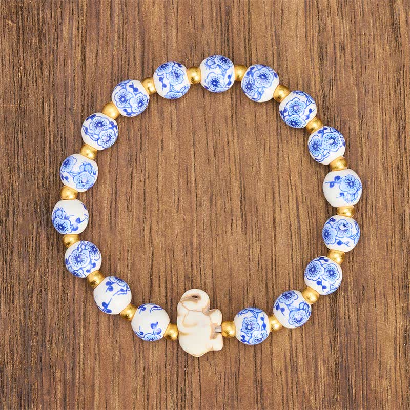 Buddha Stones Pulsera redonda de cuentas florales con forma de elefante de porcelana blanca - image 1