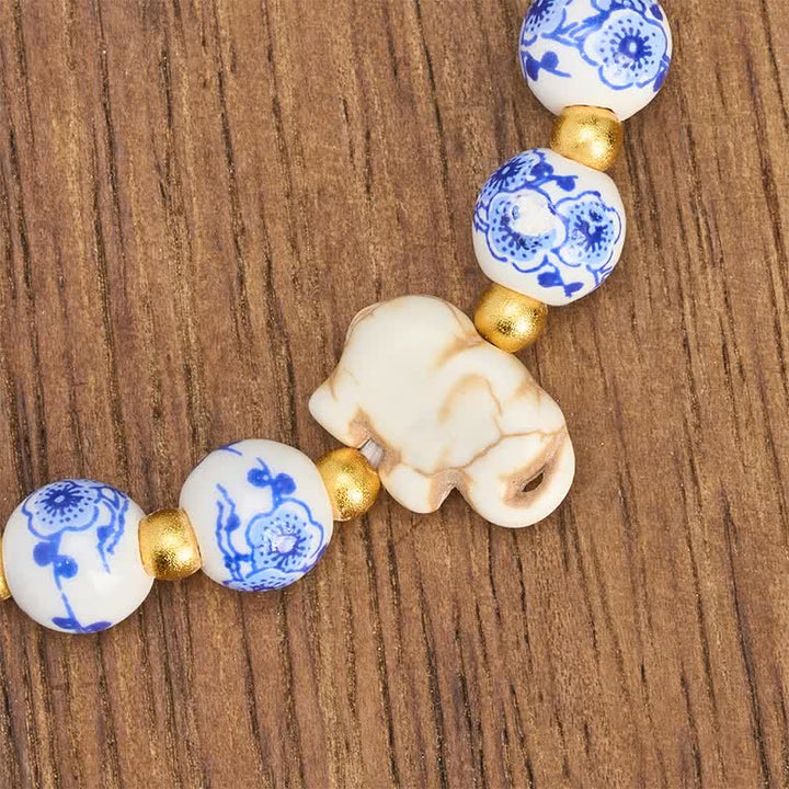 Buddha Stones Pulsera redonda de cuentas florales con forma de elefante de porcelana blanca - image 8