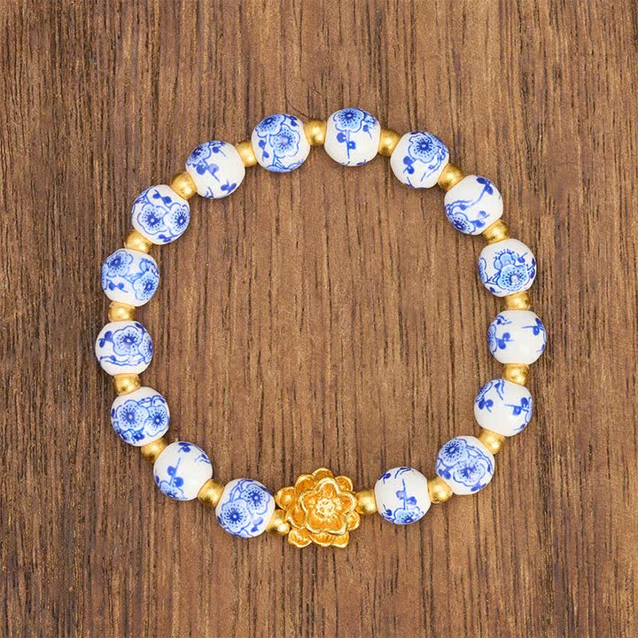 Buddha Stones Pulsera redonda de cuentas de porcelana blanca con diseño de loto e iluminación - image 1