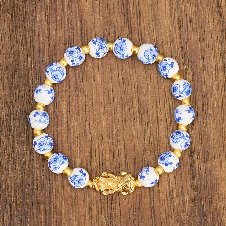 Buddha Stones Pulsera de porcelana blanca PiXiu con cuentas florales azules de buena fortuna - image 1