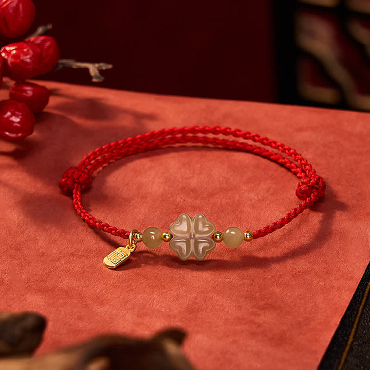 Pulsera de hilo rojo con Buddha Stones, jade Hetian natural, trébol de cuatro hojas y carácter Fu, símbolo de la suerte. - Trébol de cuatro hojas (circunferencia de la muñeca: 16-18 cm) - image 0
