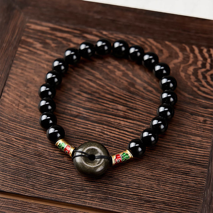 Buddha Stones Hebilla de la paz de obsidiana dorada brillante, pulsera de cuentas redondas de obsidiana negra con forma de pez koi para protección - image 1