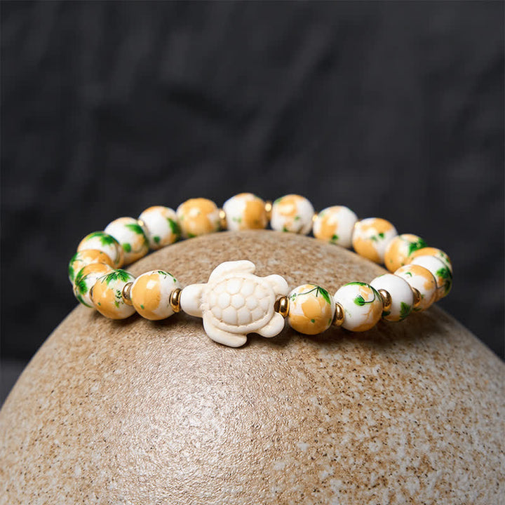 Buddha Stones Pulsera de la riqueza con diseño de tortuga y turquesa blanca natural - image 3