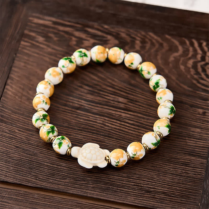 Buddha Stones Pulsera de la riqueza con diseño de tortuga y turquesa blanca natural - image 1