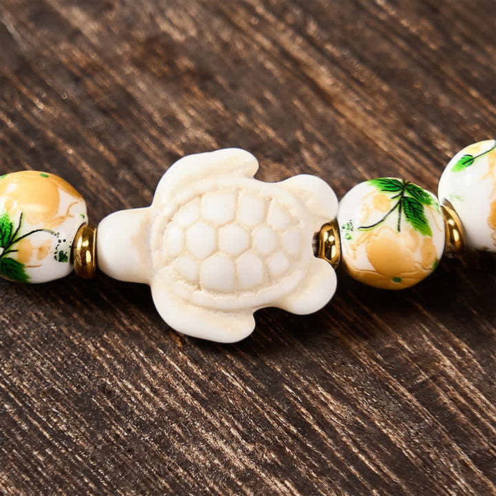Buddha Stones Pulsera de la riqueza con diseño de tortuga y turquesa blanca natural - image 10