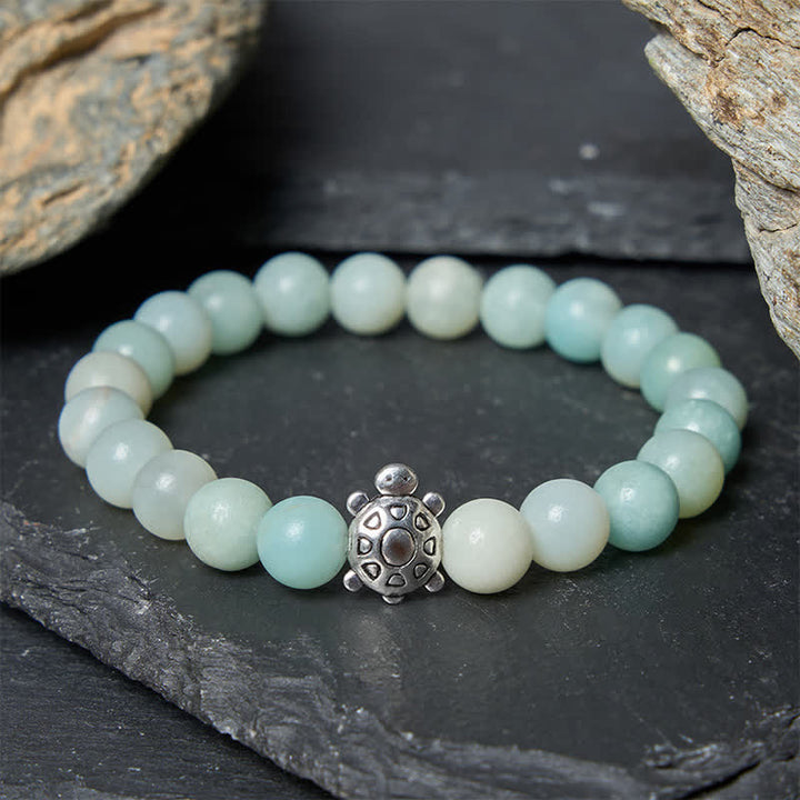Buddha Stones Pulsera de cuentas redondas de amazonita y cobre con forma de tortuga, pulida a mano. - image 1