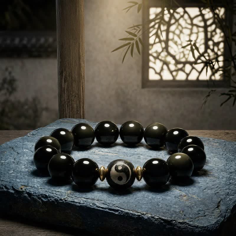 Buddha Stones Pulsera de protección y equilibrio Yin Yang de obsidiana con brillo dorado - image 1