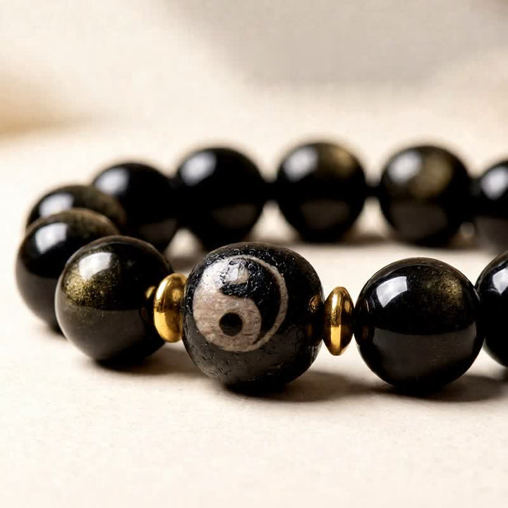 Buddha Stones Pulsera de protección y equilibrio Yin Yang de obsidiana con brillo dorado - image 2
