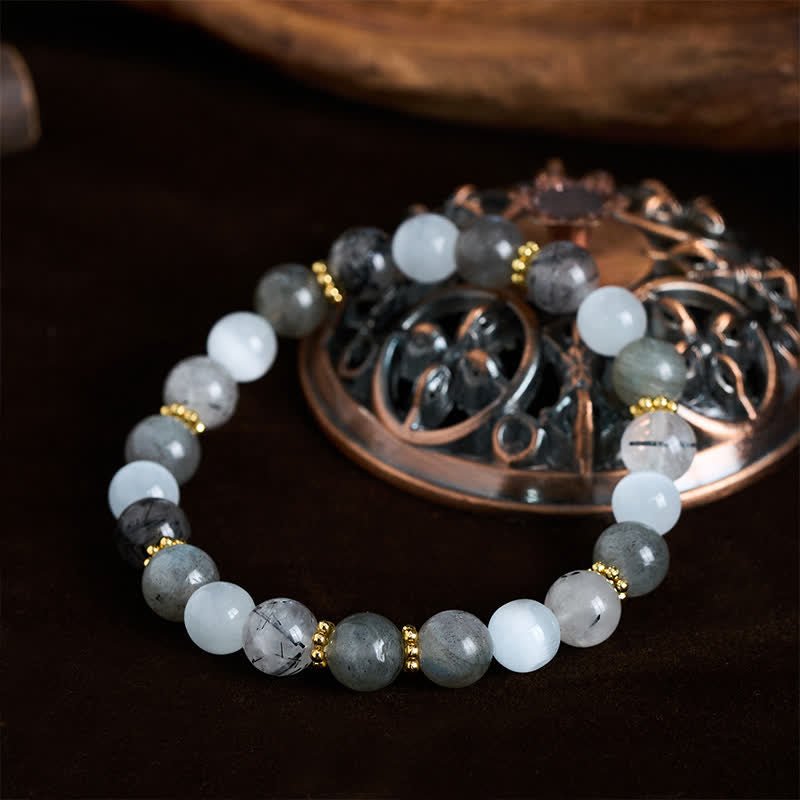 Buddha Stones Pulsera de la abundancia con cuentas de cuarzo rutilado negro, ojo de gato blanco y piedra lunar. - image 1