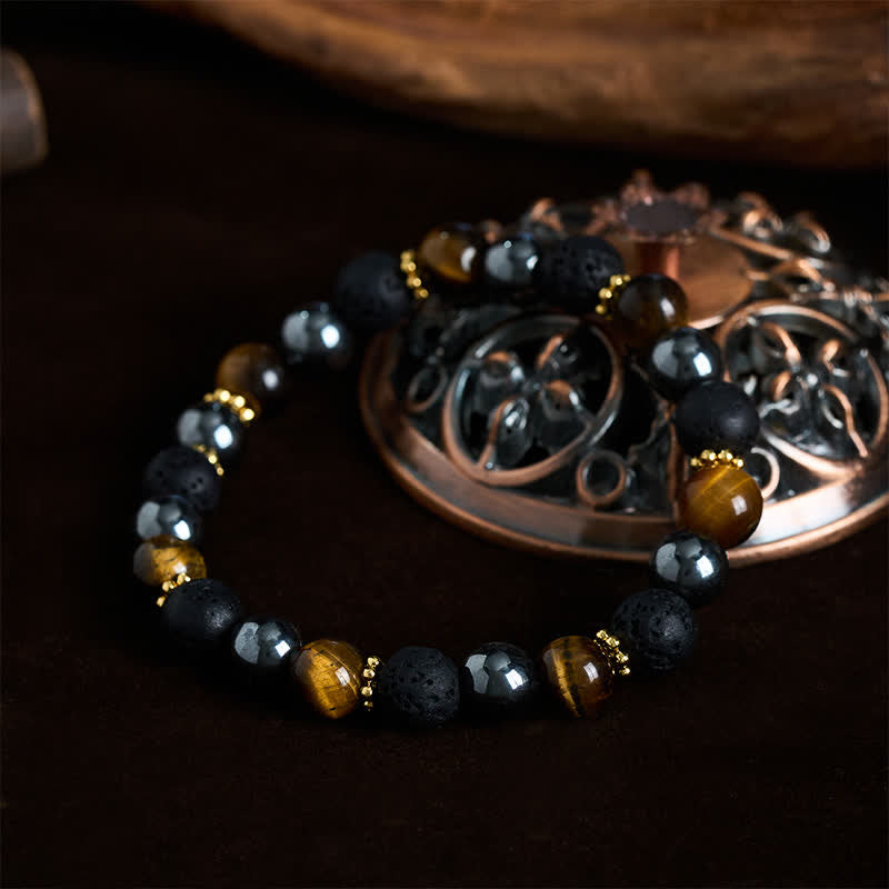 Buddha Stones Pulsera de fuerza con cuentas de hematita, roca volcánica y ojo de tigre - image 1