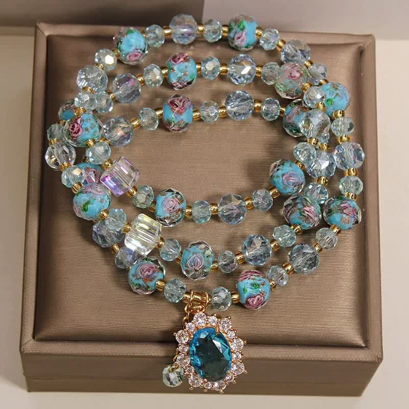 Buddha Stones Pulsera de triple vuelta con dije ovalado floral de cuentas de vidrio Blue Liuli y dije de cristal azul. - image 1