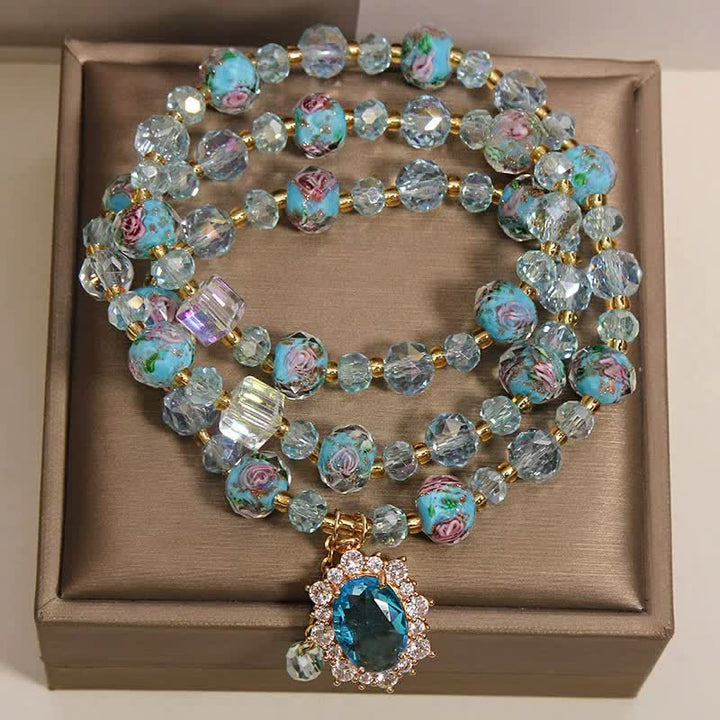 Buddha Stones Pulsera de triple vuelta con dije ovalado floral de cuentas de vidrio Blue Liuli y dije de cristal azul. - image 1