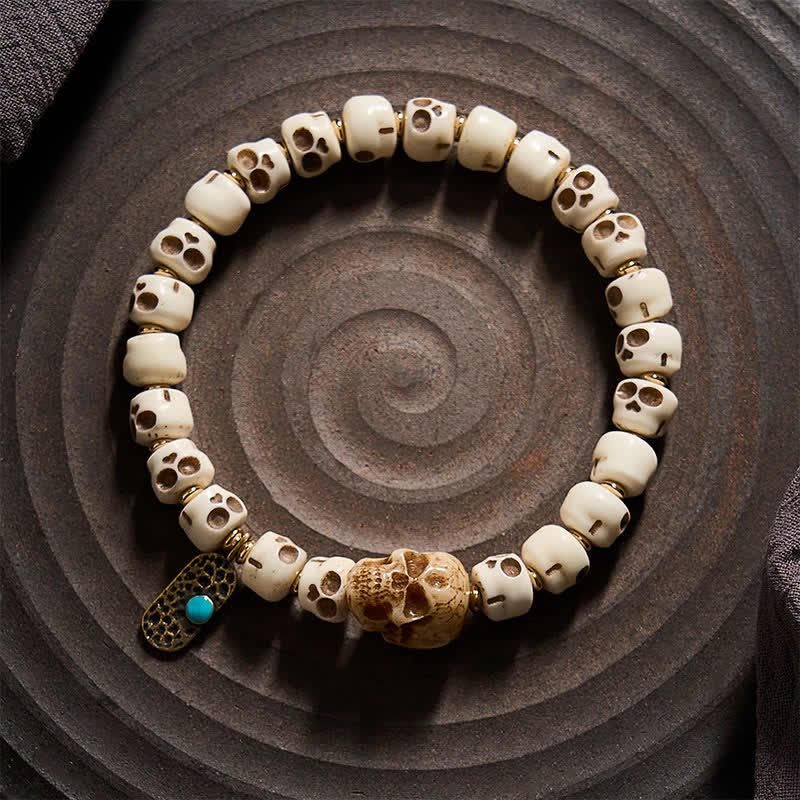 Buddha Stones Pulsera tibetana con cuentas de hueso talladas a mano, diseño de calavera del Señor del Bosque de los Cadáveres, que simboliza la fuerza y ​​el cambio. - image 1