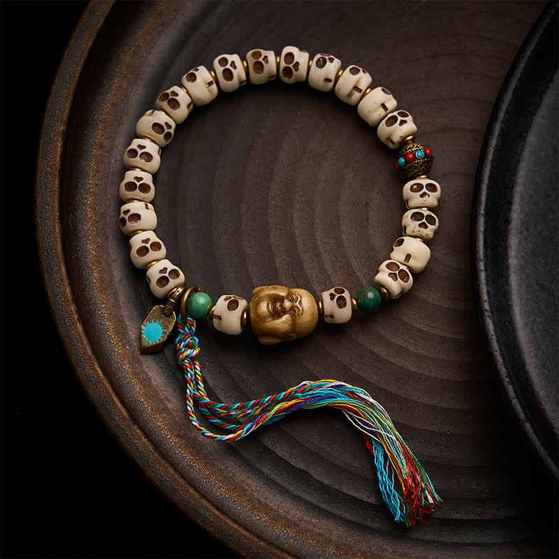 Buddha Stones Pulsera de cuentas de hueso tibetanas con diseño de calavera del Señor del Bosque de los Cadáveres, símbolo de fuerza y ​​cambio. - 9 × 6,3 mm - image 0