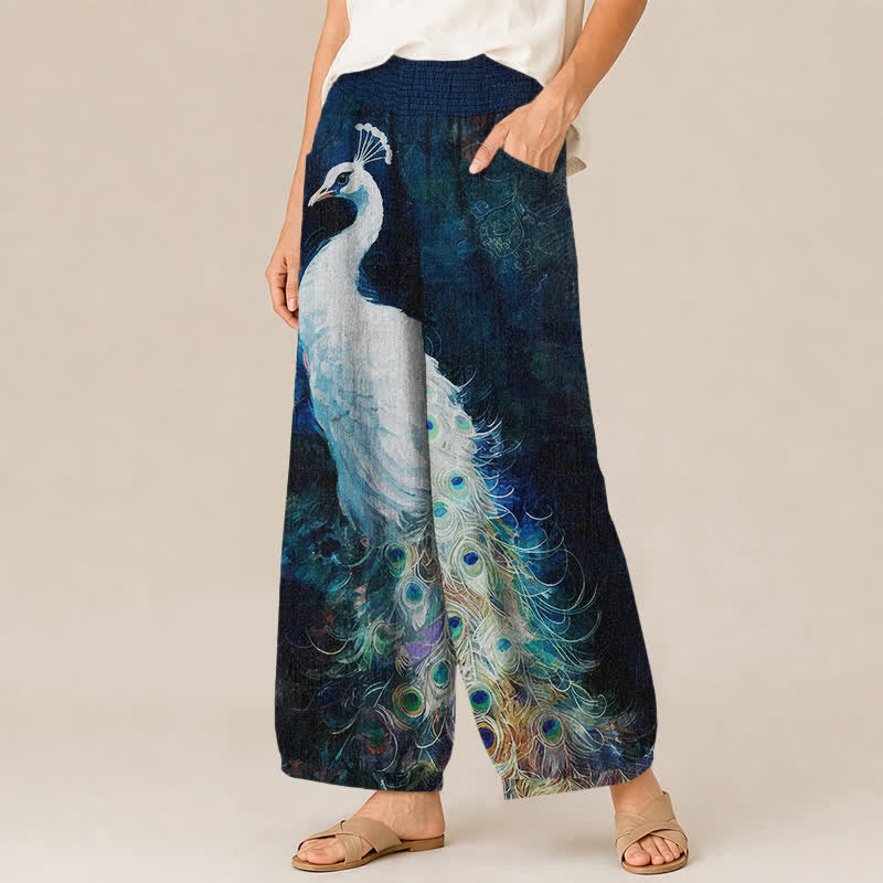 Buddha Stones Pantalones harem de mujer de algodón blanco con estampado de plumas de pavo real, cintura elástica plisada y bolsillos. - image 1