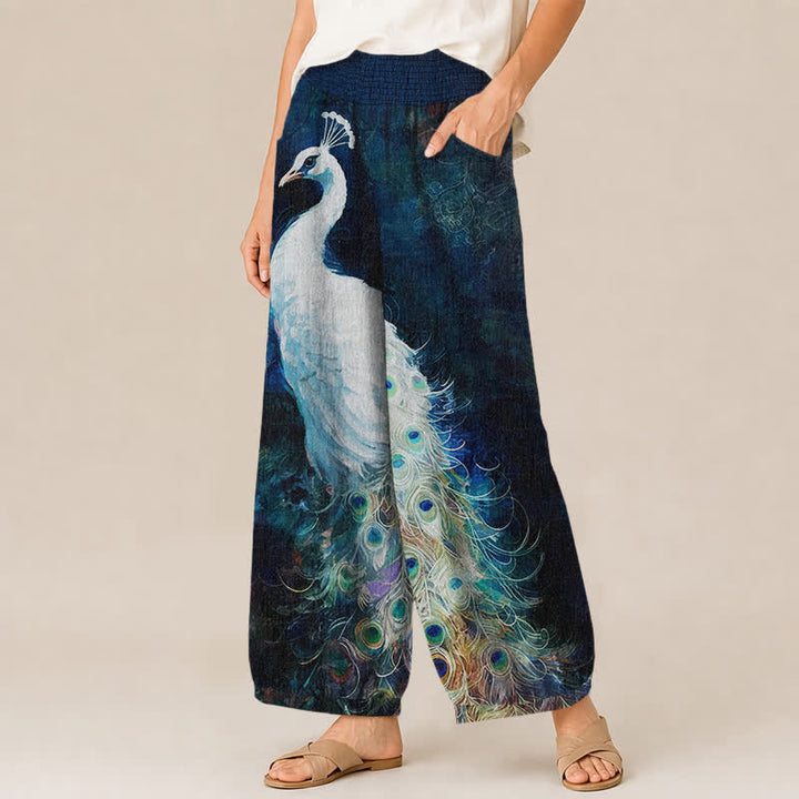 Buddha Stones Pantalones harem de mujer de algodón blanco con estampado de plumas de pavo real, cintura elástica plisada y bolsillos. - image 1